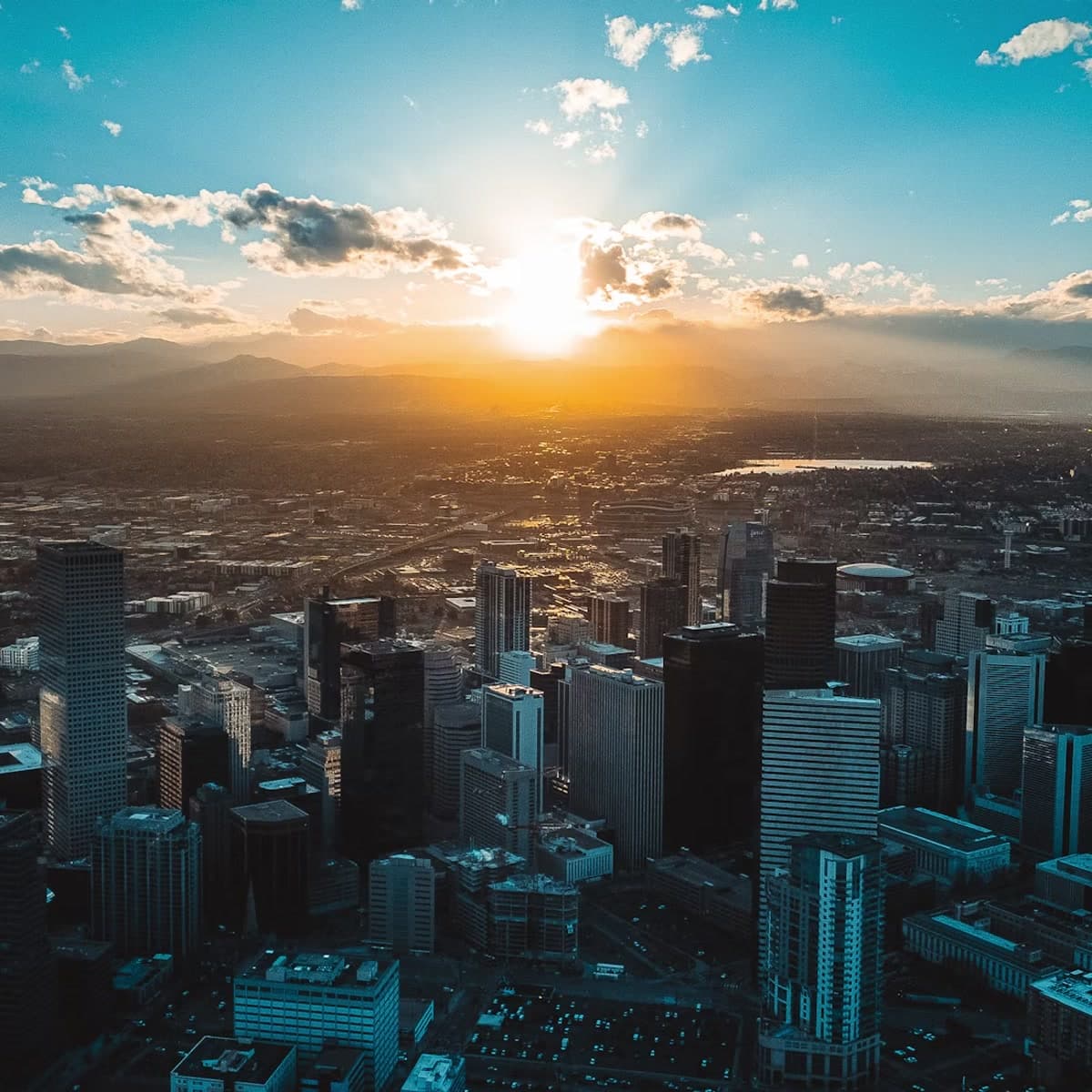 Denver skyline at sunset on the official RMFACC Luma event cover